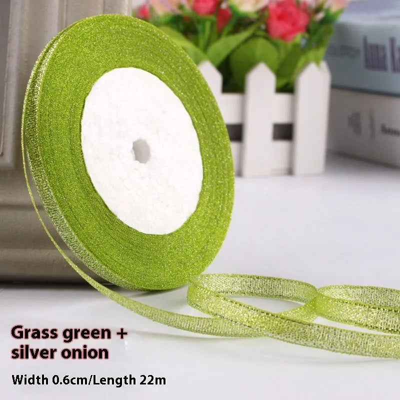 Roll of 0.6cm wide polyester gift ribbon in various colours including gold leaf, coffee and sky blue options