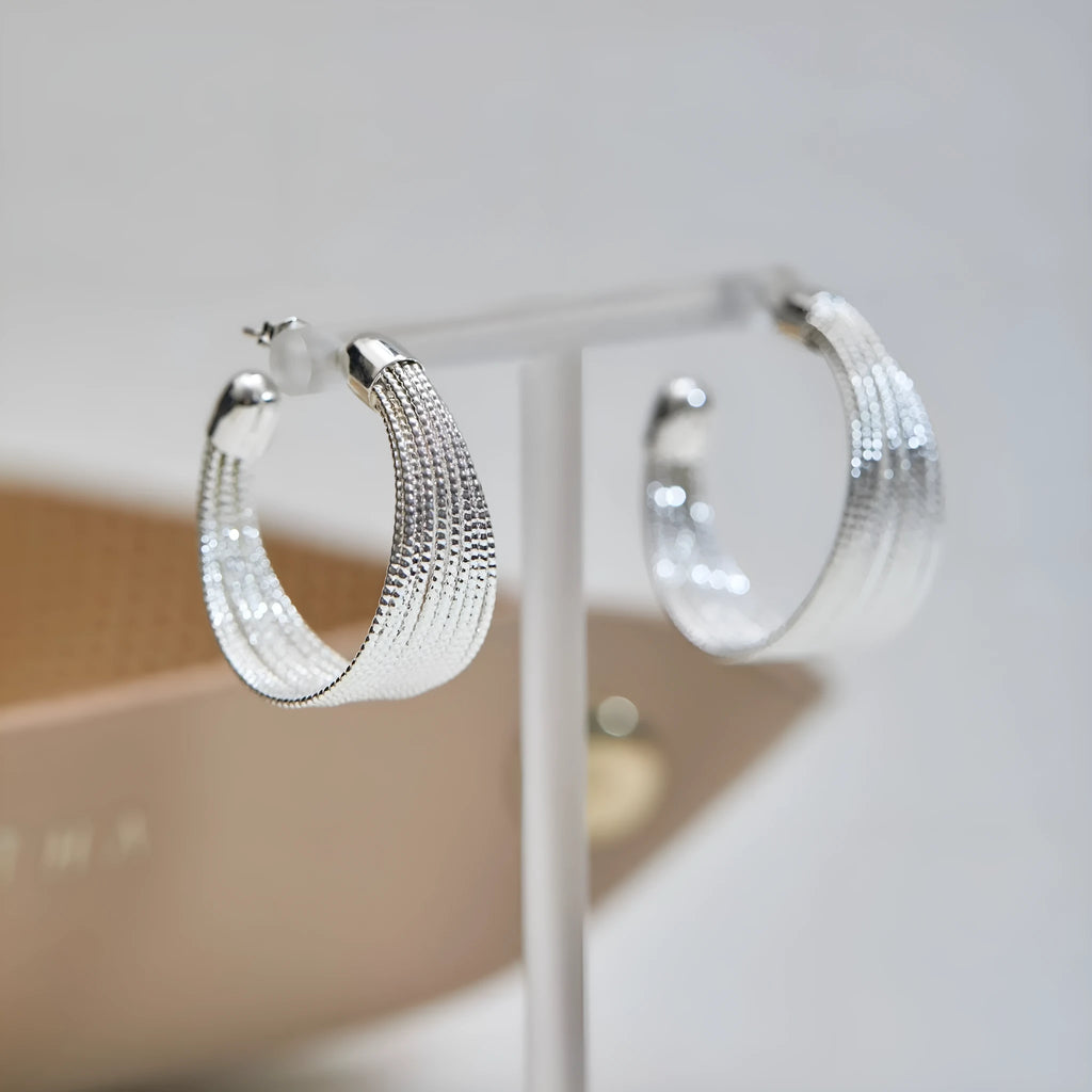Geometric copper stud and clip earrings in gold and silver electroplated colours with simple multi-layer design