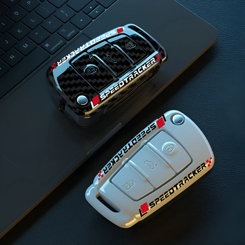 Car key cover with carbon fibre texture and mirrored detailing, white colour option shown alongside