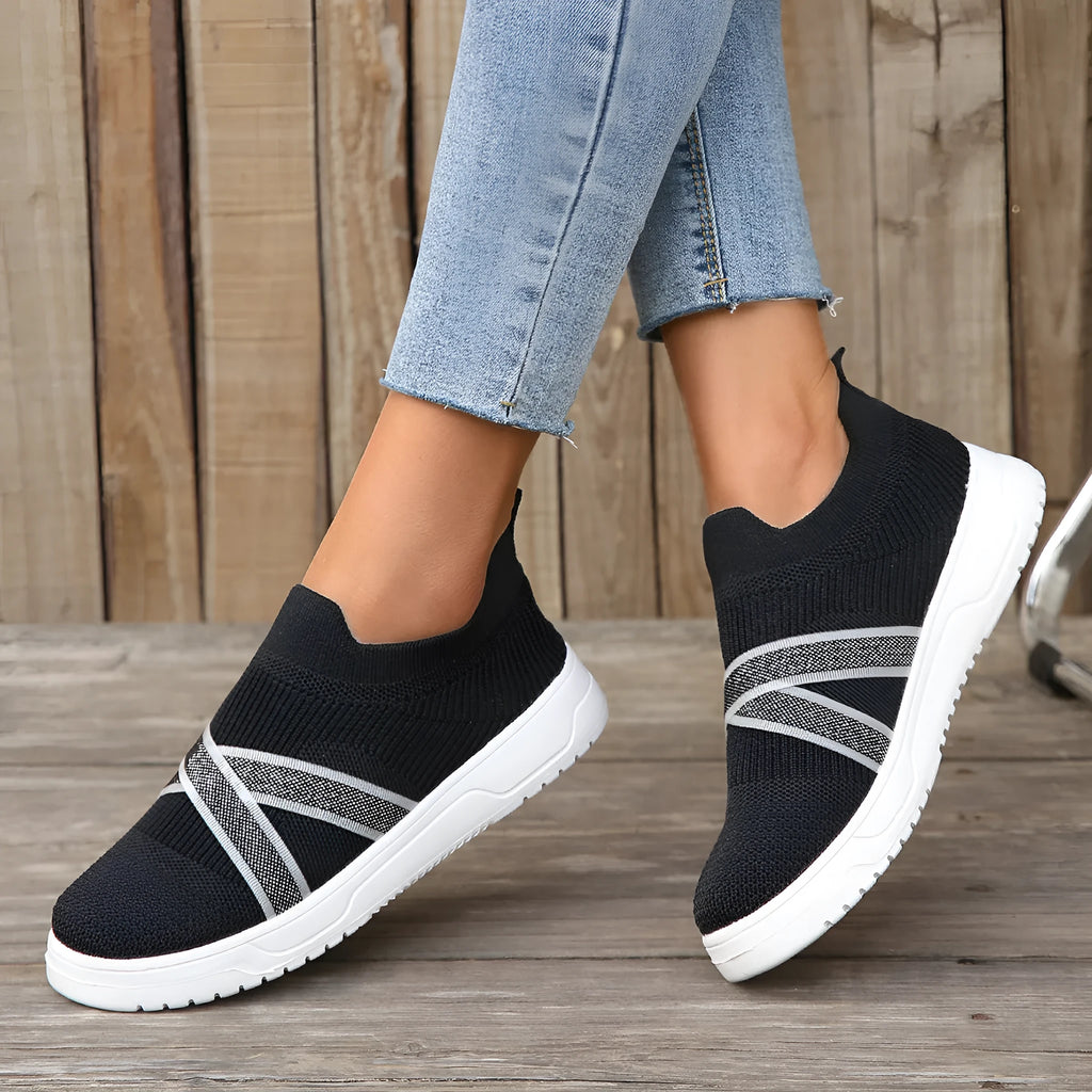 Black women's flat mesh shoes with flyknit fabric upper and tassel detail