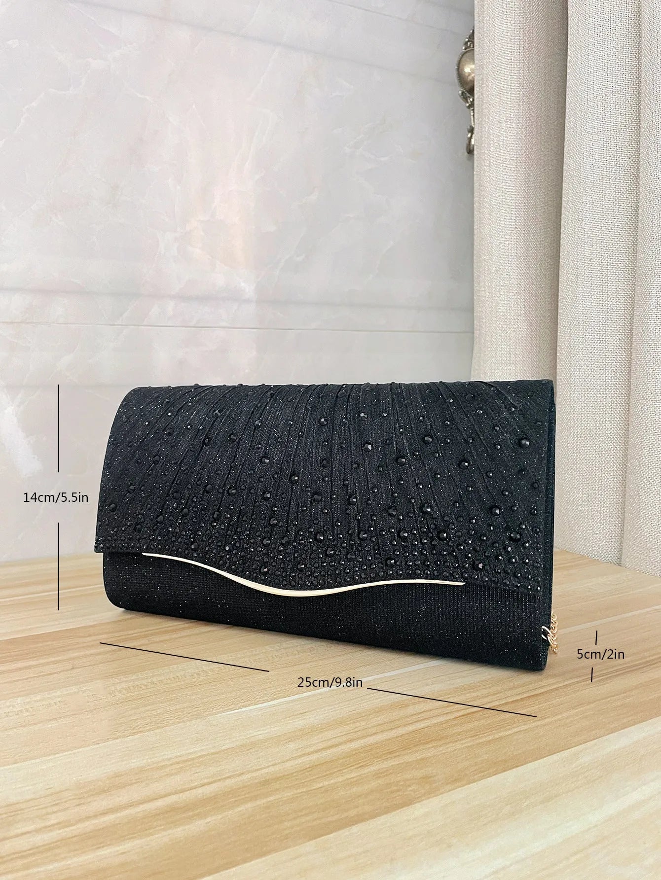 Women's dinner clutch bag in woven fabric with rhinestone dress garment design, available in black, champagne, and silver