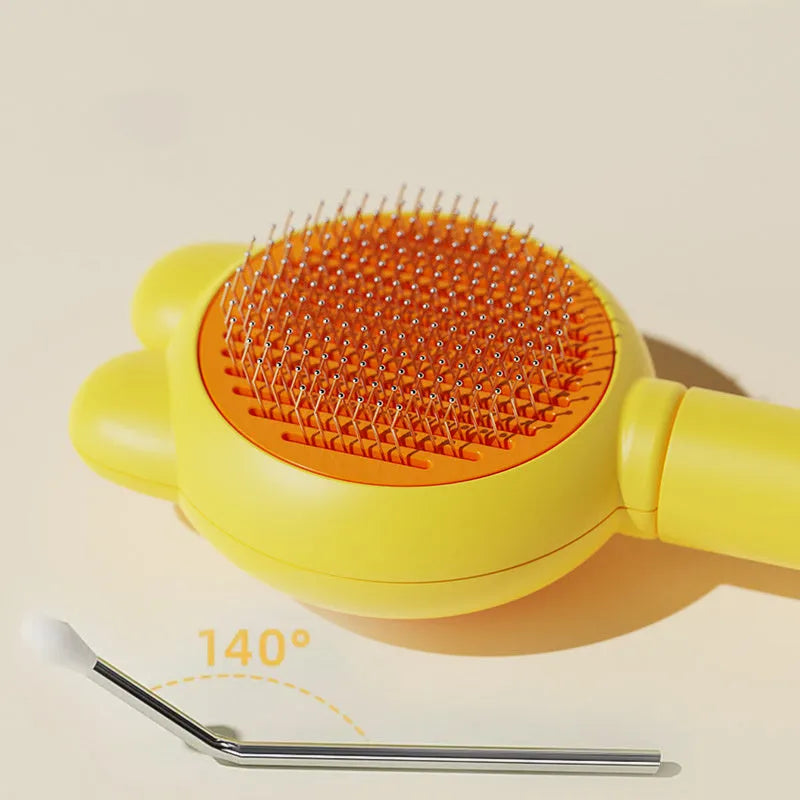 Green self-cleaning cat brush with metal comb and release button for pet grooming.