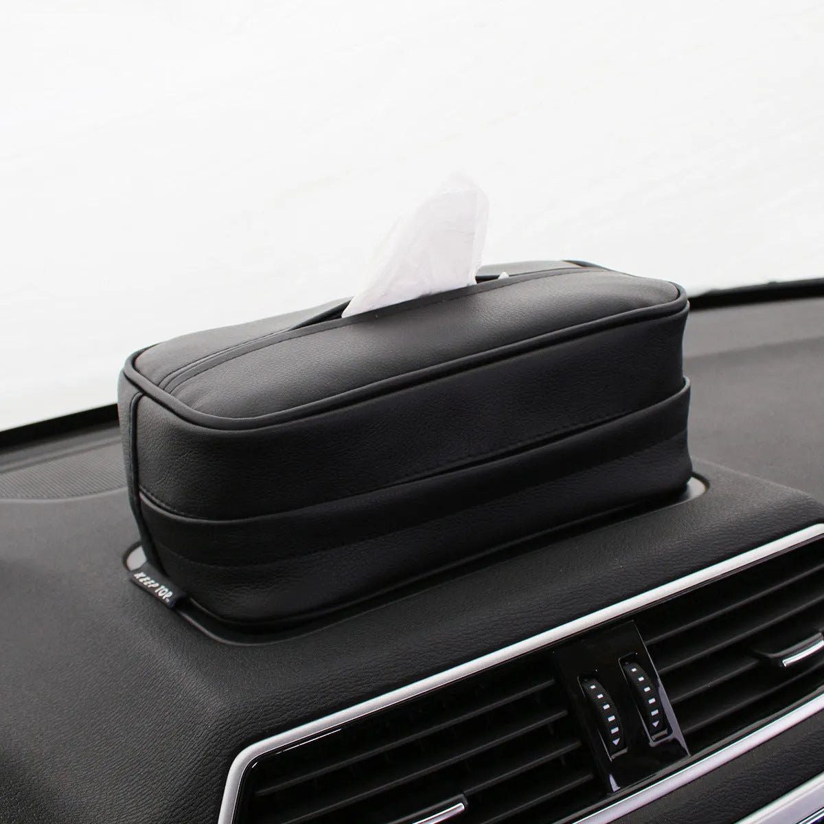 Black PU leather hanging storage box for paper bags, shown suspended, with dimensions 23x13x9cm.