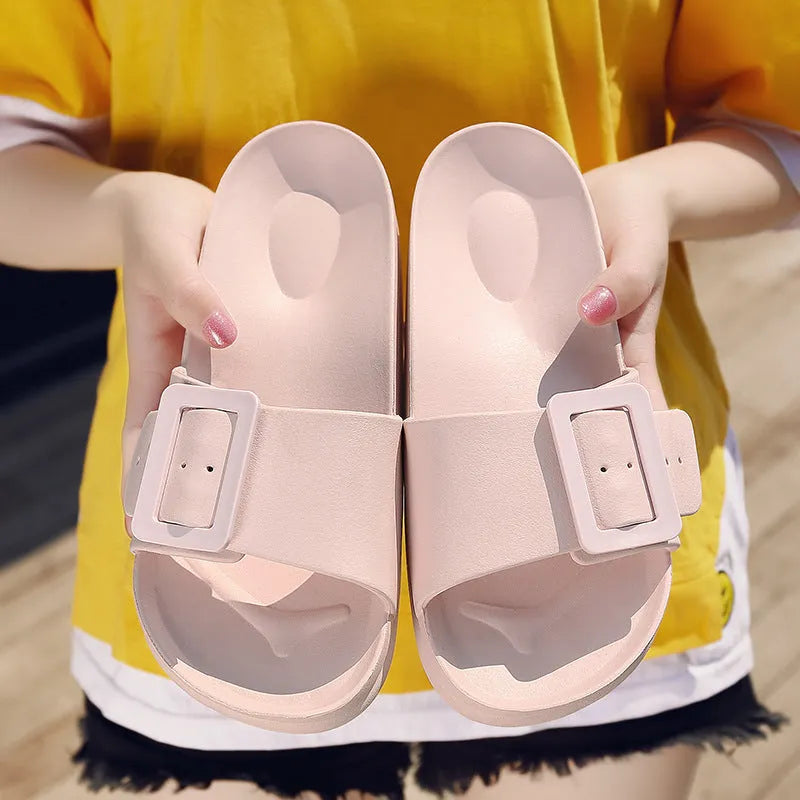 Women's grey blue flip-flop slippers with a buckle strap and soft EVA sole.