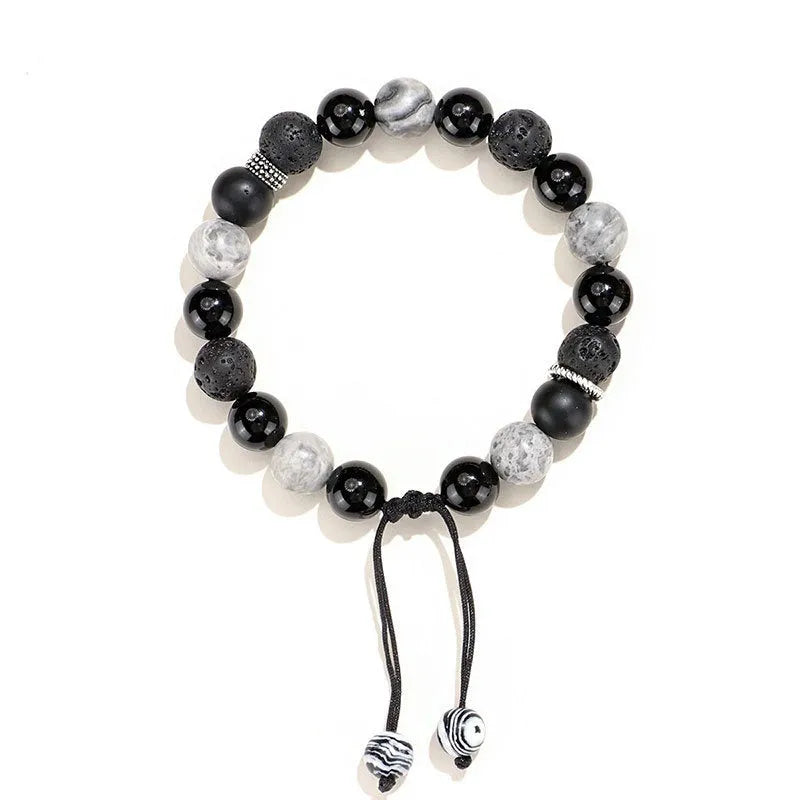 Black agate map stone volcanic bracelet with diamond-shaped stones and electroplated metal components