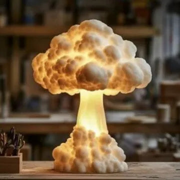 Mushroom cloud shaped atomic explosion table lamp with USB power cable on a desk.