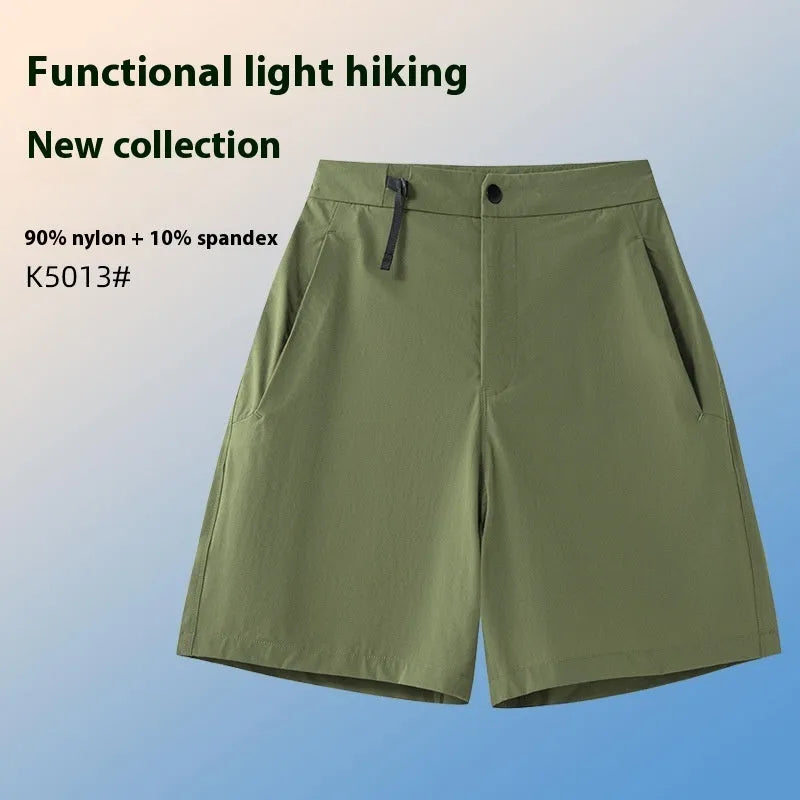 Men's solid colour quick-dry sports shorts with elastic waistband on a grey background.