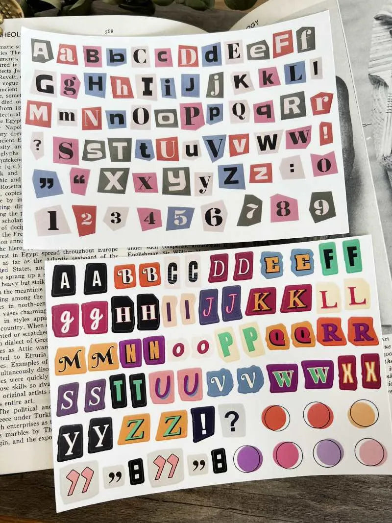 Set of printed cute style decoration stickers showing English letters, numbers, and weekly words on sheets.