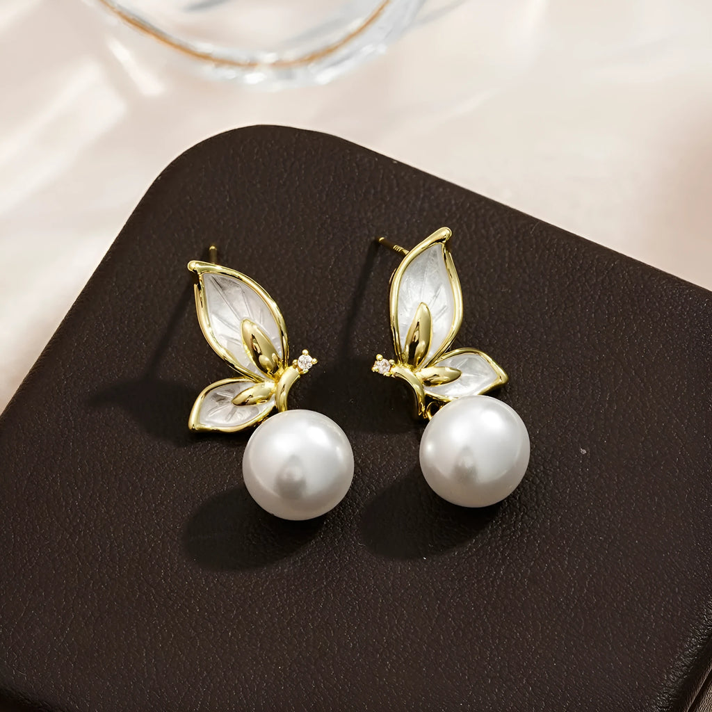 A pair of women's butterfly stud earrings in electroplated copper, colour PT0203, with simple style and painted zircon detail.