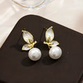 A pair of women's butterfly stud earrings in electroplated copper, colour PT0203, with simple style and painted zircon detail.