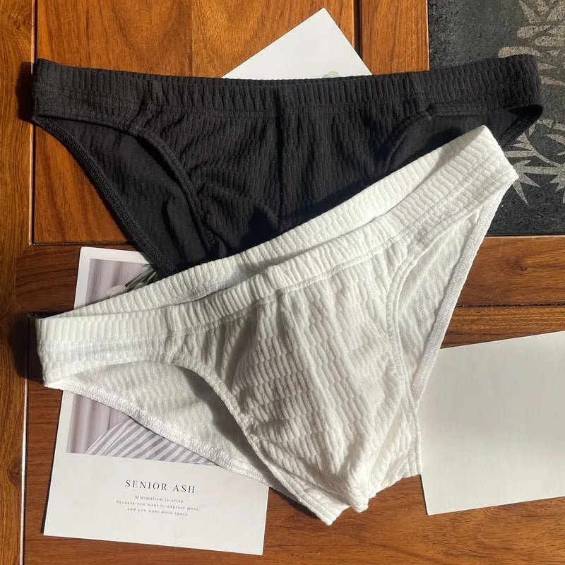 Men's solid colour pure cotton triangle briefs with a mid-waist body-shaping design.