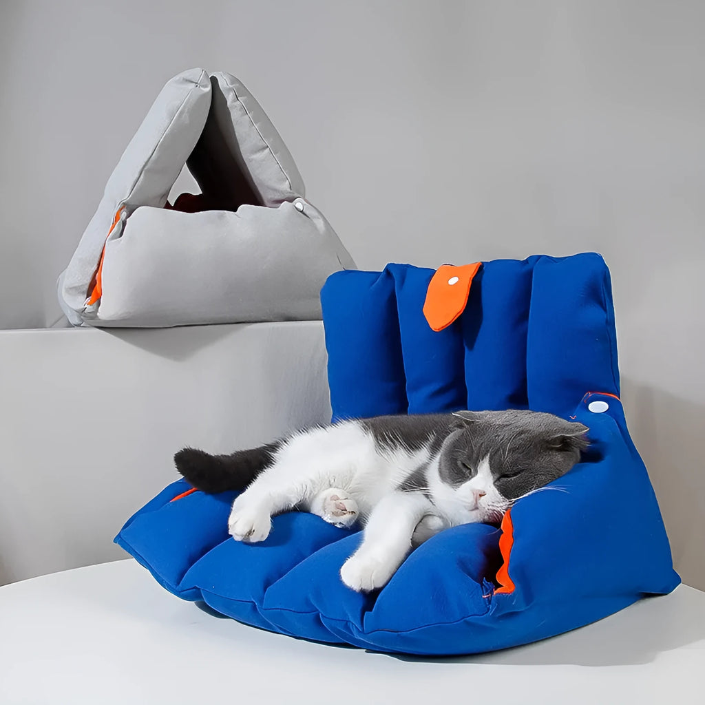 Triangular cat bed with blue removable cotton cover showing combination holes