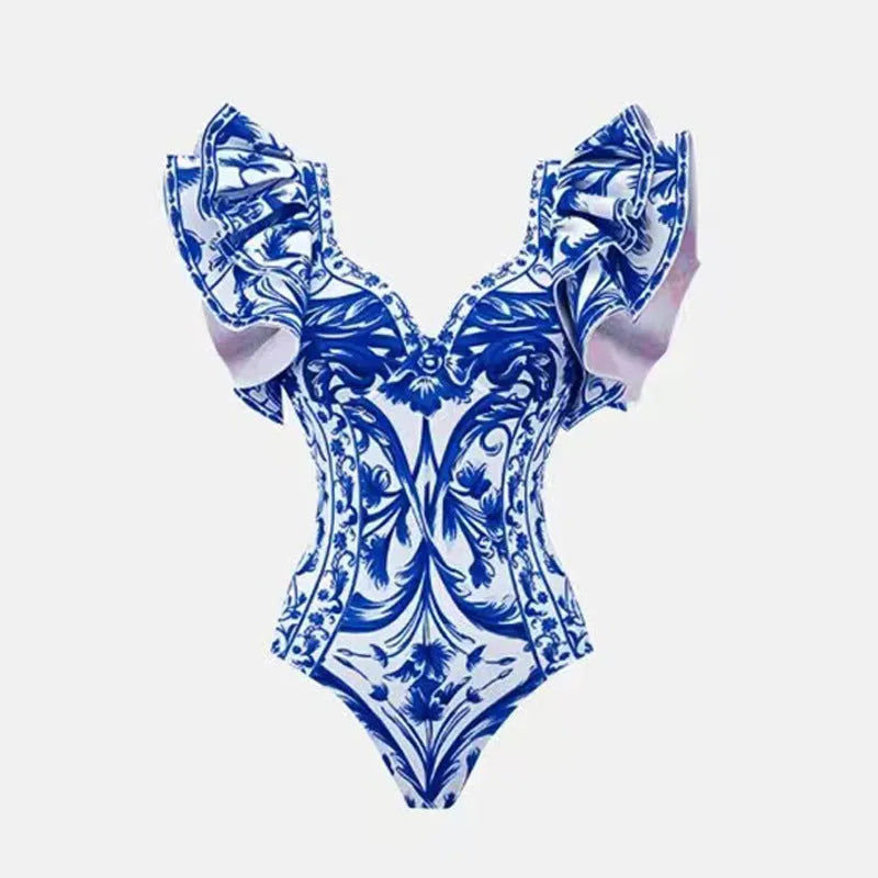 Women's printed polyester one-piece swimsuit on a hanger.