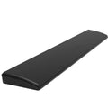 Black Jue USB wired keyboard wrist rest in black colour on a desktop.