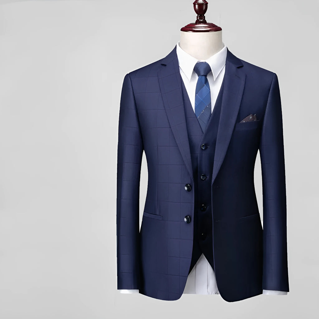 Men's navy blue slim fit three-piece suit with vest, jacket, and trousers for business casual occasions