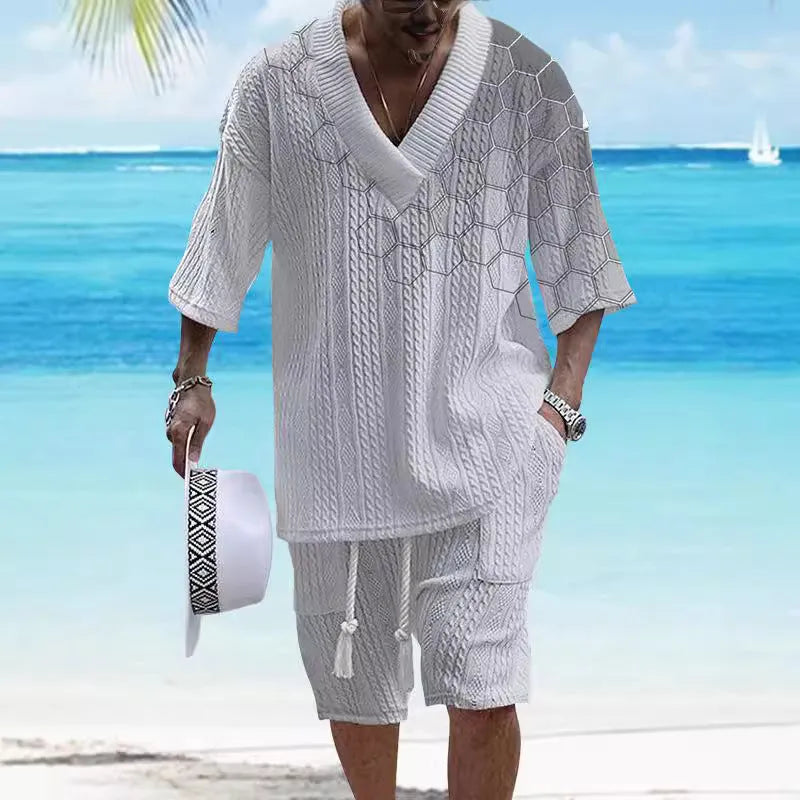 Men's grey printed knitted short-sleeved top and matching shorts on a hanger.