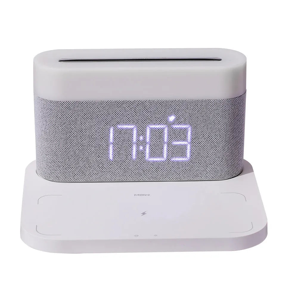 Black and white minimalist wireless charging station with digital clock, night light, and thermal cup.