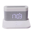 Black and white minimalist wireless charging station with digital clock, night light, and thermal cup.