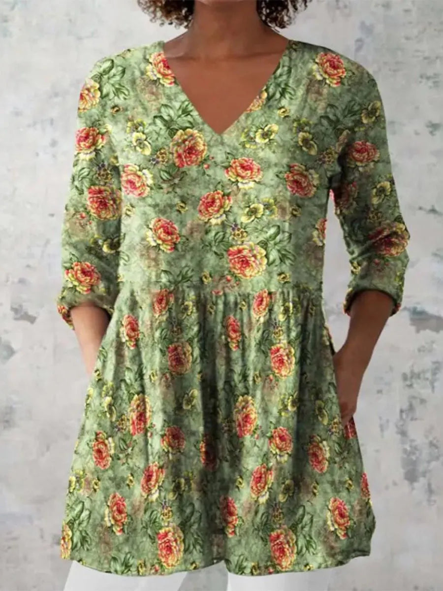 Women's long loose dress with a blue and white wave print pattern, featuring three-quarter sleeves and a wide waist.