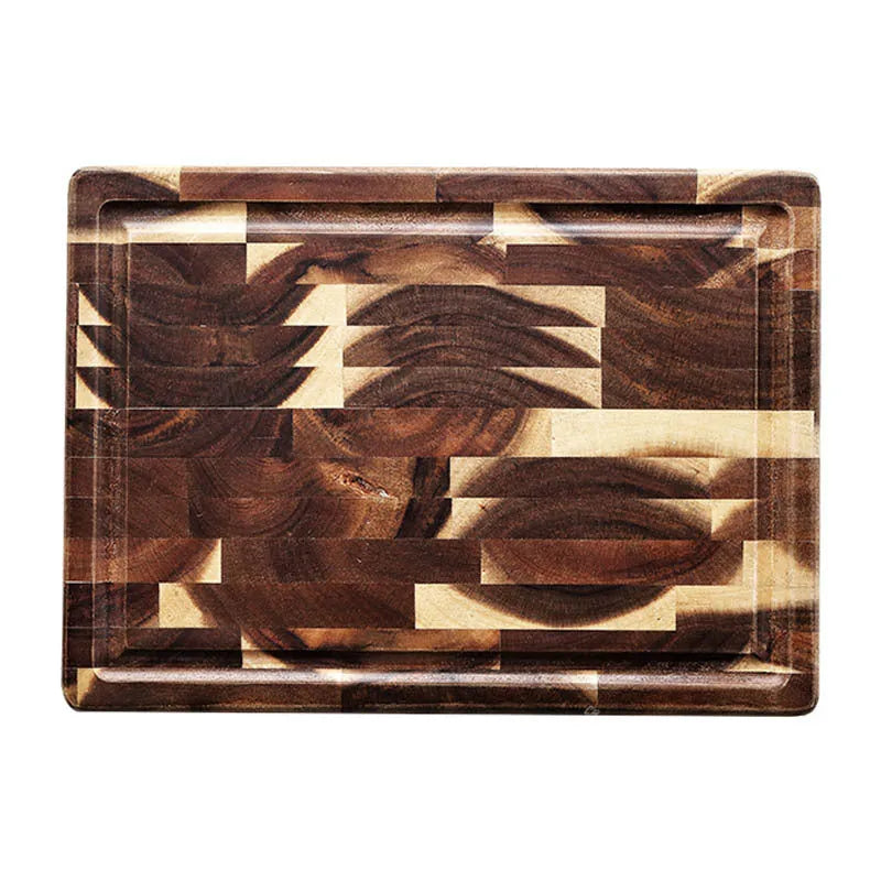 Brown solid acacia wood chopping board with 3cm thickness on a kitchen counter.