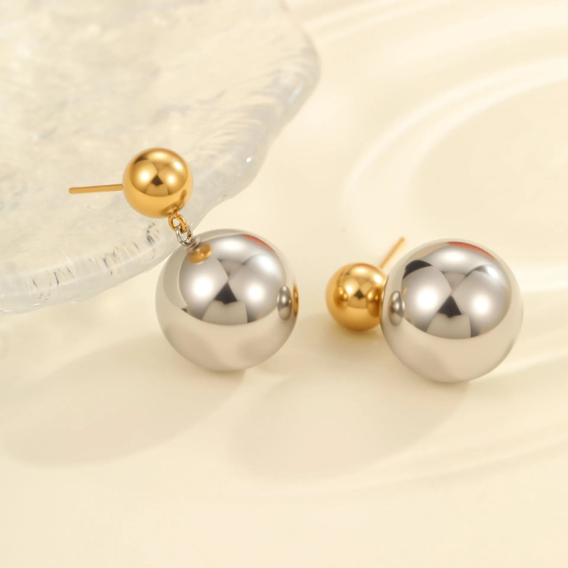 Stainless steel ear studs with 18K gold electroplating and round bead geometry design