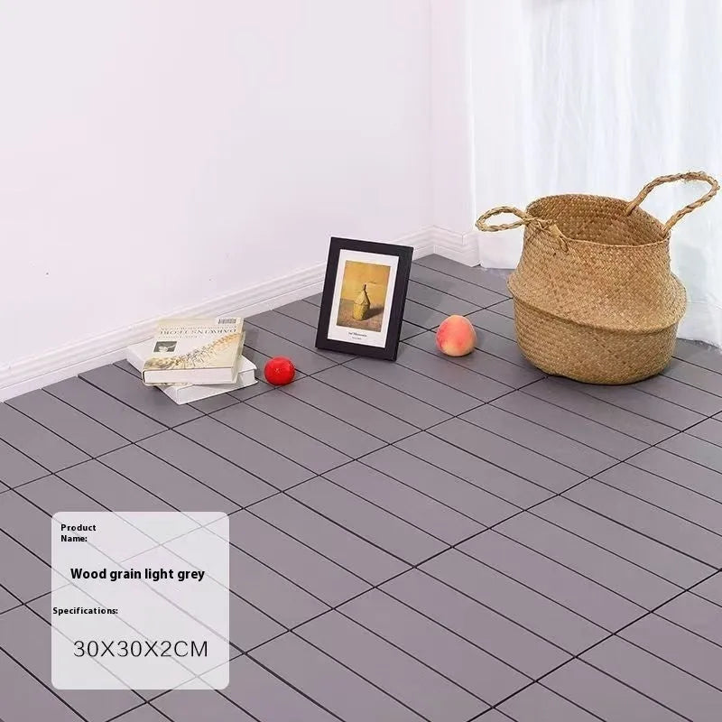 Wood grain plastic interlocking floor tile showing non-slip surface texture