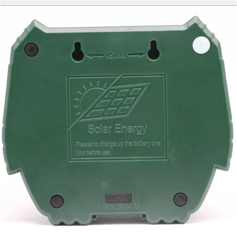 Green solar ultrasonic animal repellent with solar panel showing 12x13x5cm dimensions
