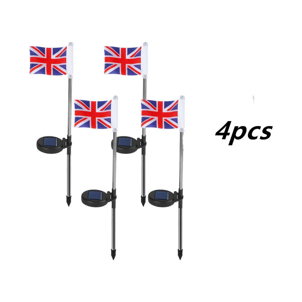Solar-powered garden flag light displaying either American or British flag design with stainless steel pole and solar panel