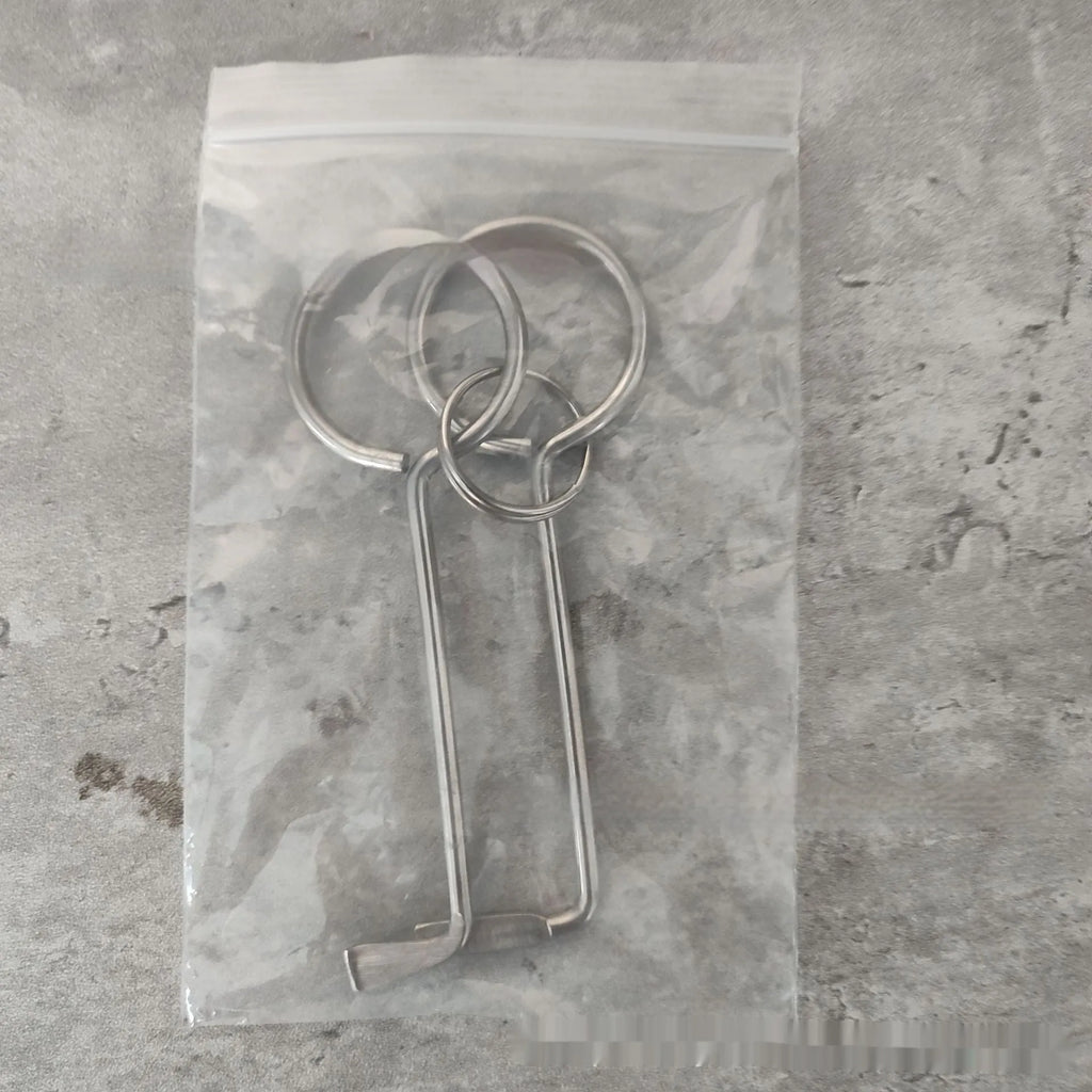 Two identical silver alloy steel wrench tools from a portable household repair set.