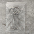 Two identical silver alloy steel wrench tools from a portable household repair set.