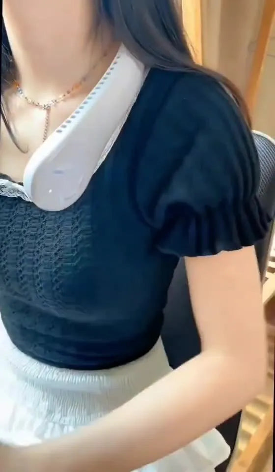 White USB rechargeable bladeless neck fan worn around a person's neck.