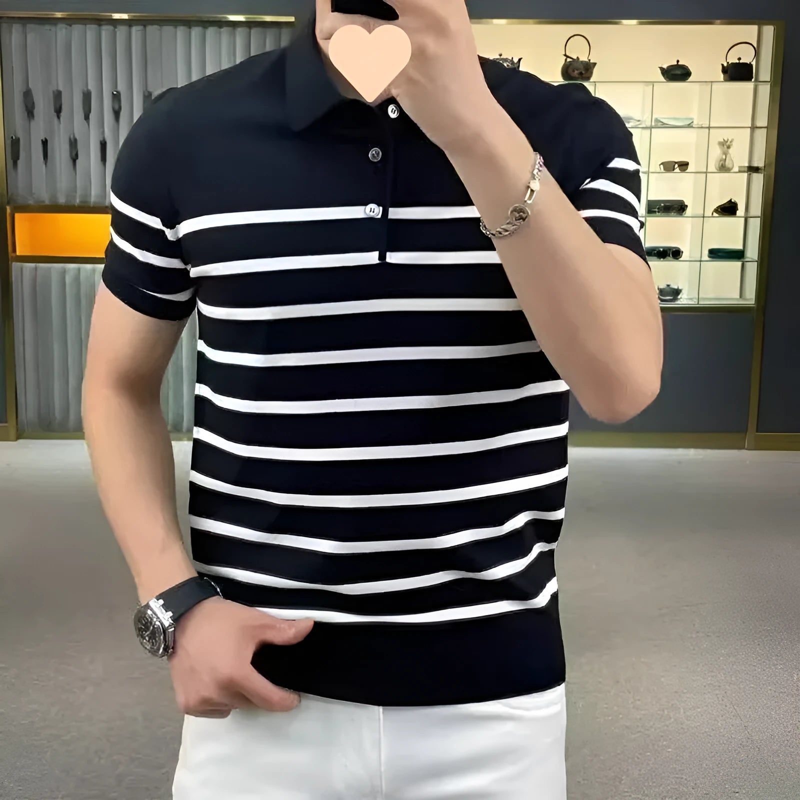 Man wearing a black and white striped knitted t-shirt with a lapel collar