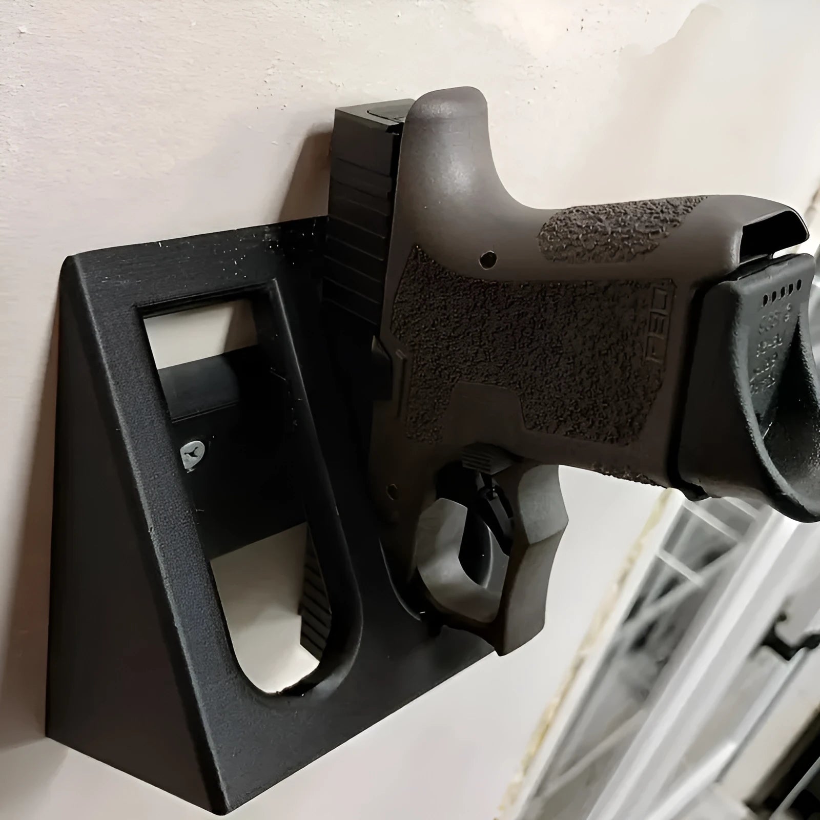Black punk-style plastic pistol stand for firearm display