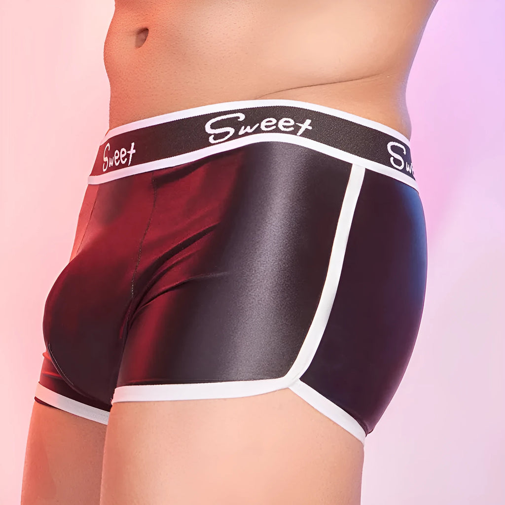 Men's shiny silky nylon boxer shorts in black, white, and sapphire blue colours showing breathable construction
