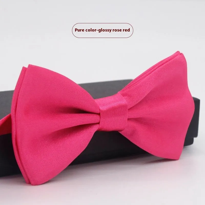Men's flat head style polyester bow tie in a solid colour, shown with adjustable neck strap.