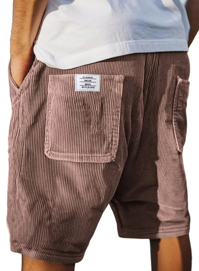 Men's grey corduroy shorts with multiple pockets and straight-leg cut on a neutral background.