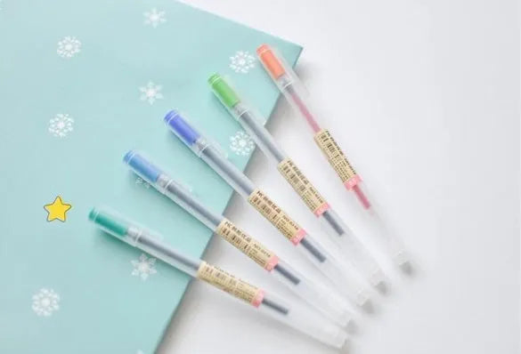 Set of 12 Muji gel pens with 0.5mm fine nibs showing ink prevention mechanism