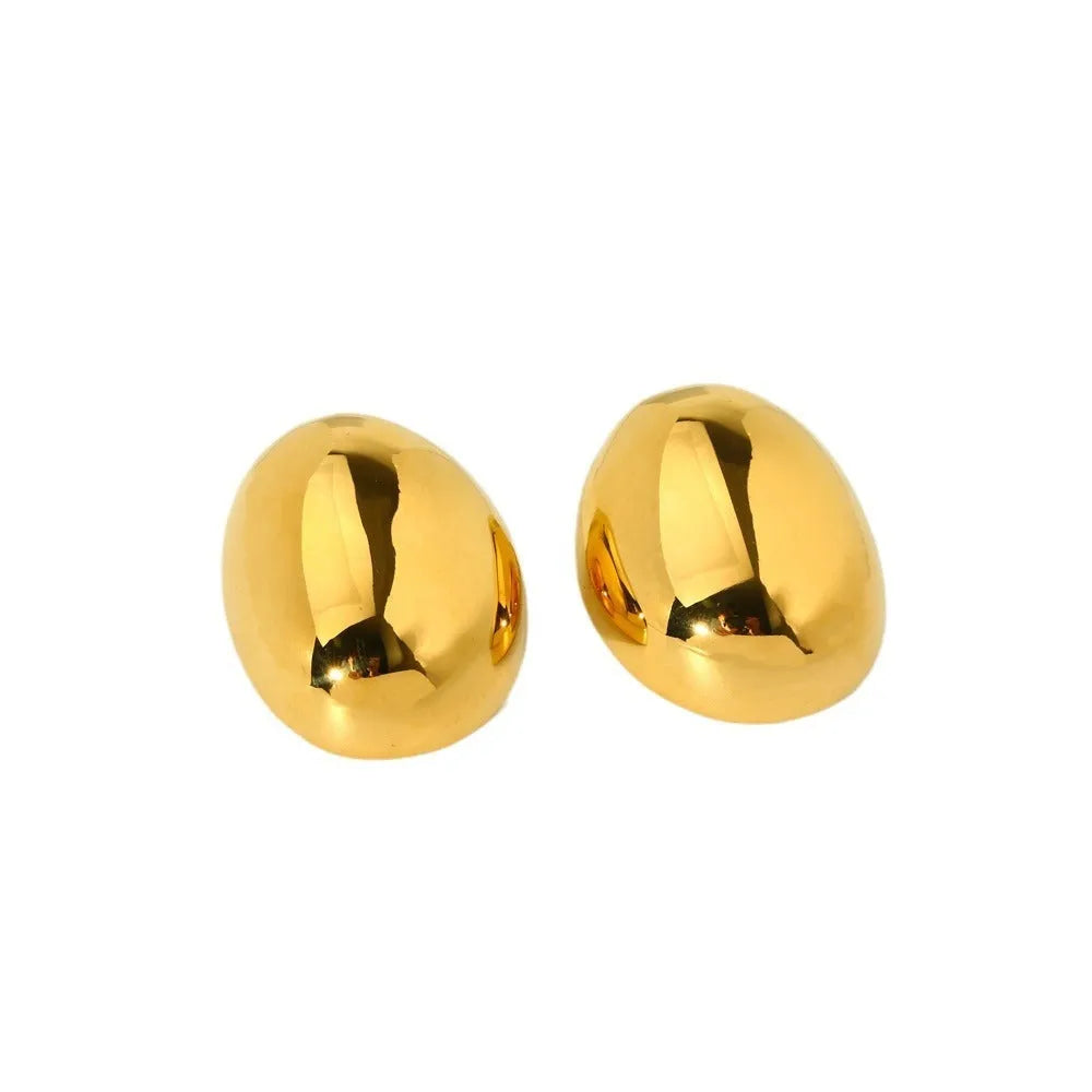 Geometric women's earrings with a gold glazed finish and simple line designs on a white background.