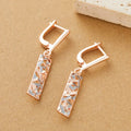 Rectangular two-tone hollow stud earrings with geometric shape and electroplated finish
