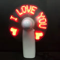 White handheld mini fan with flashing blue and red LED love pattern