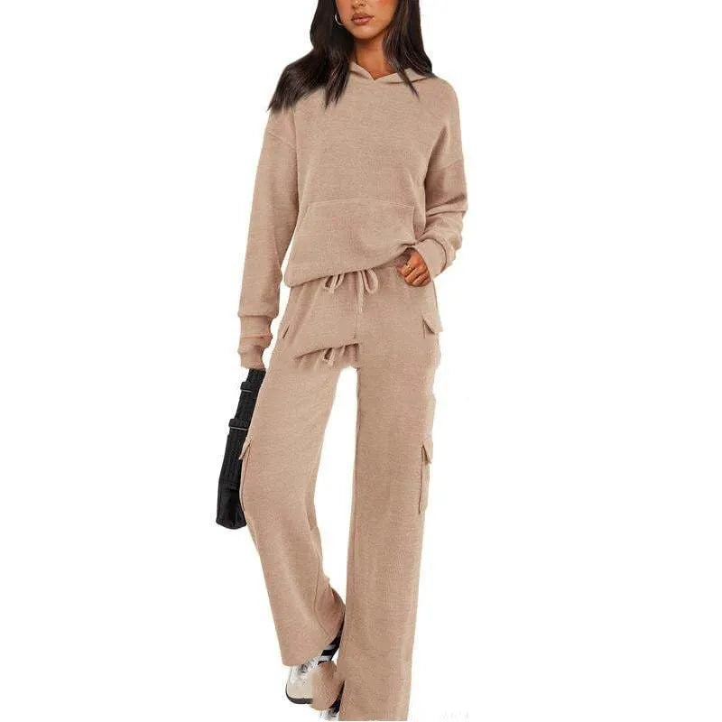 Women's long sleeve leisure sport suit top and trousers set in polyester fabric.