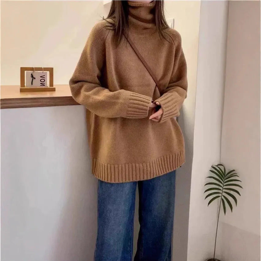 Women's loose thick turtleneck sweater with a textured 3D curling collar in a red solid colour.