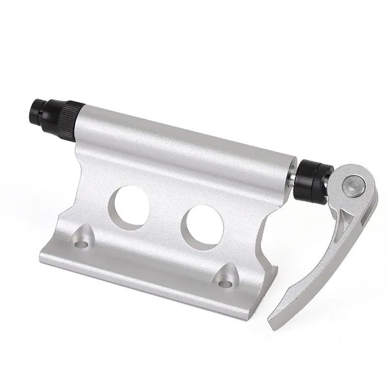 Silver metal quick release fixing clamp for a bicycle front fork.