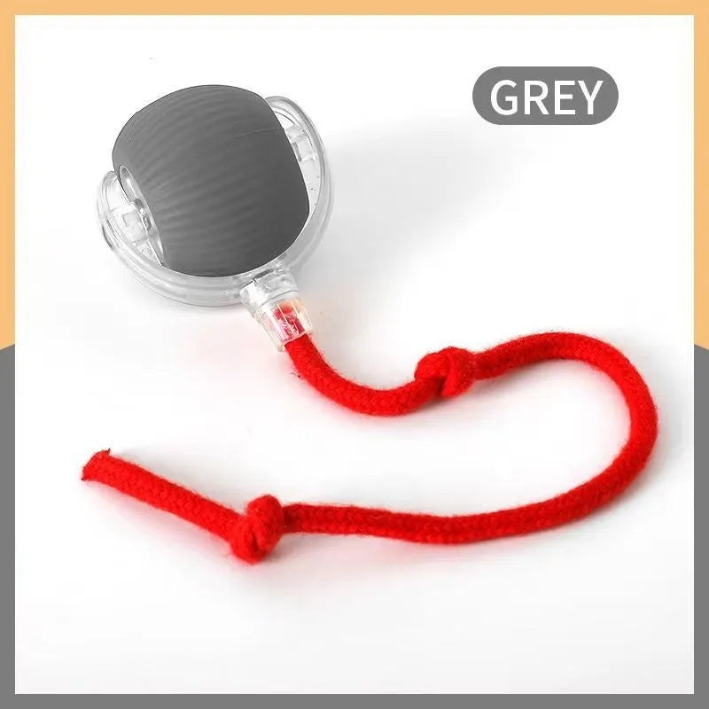 Flexible silicone rolling ball cat toy in plush red, green, and grey colours