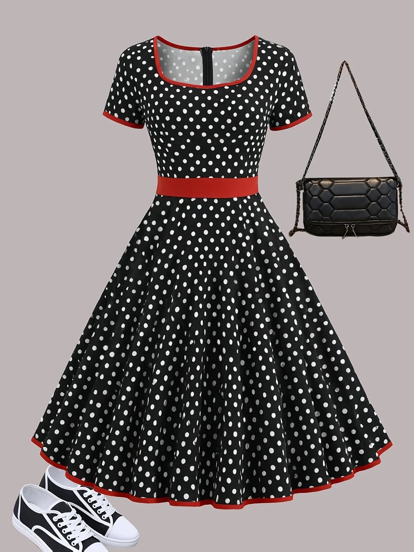 Women's multicolour polka dot pleated dress with square neckline, short sleeves, and front zip.