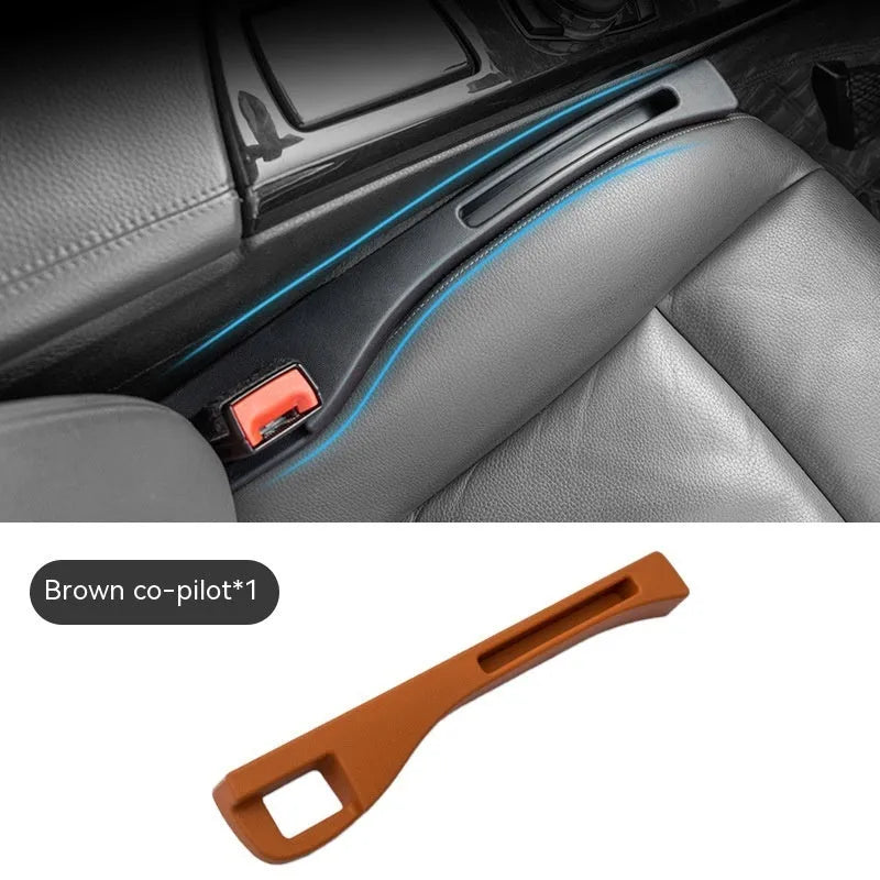 Black plastic car seat gap storage box with handle installed between car seats