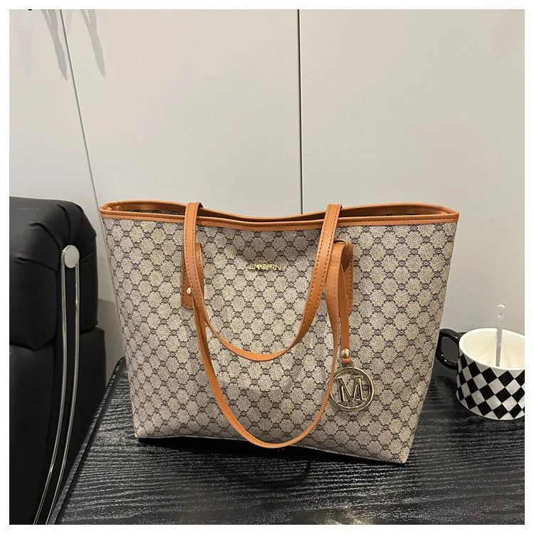 Street trend western style shoulder bag in PU material with sewn detailing, shown in black.