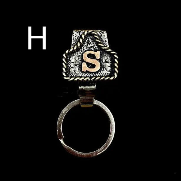 Handmade stainless steel cow tag belt key holder with engraved number plate on a split ring.