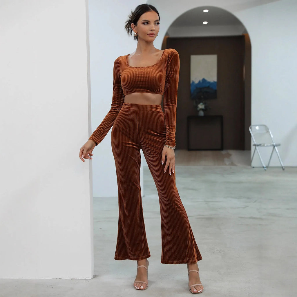 Caramel coloured long sleeve sweater and matching trousers lounge set on a hanger