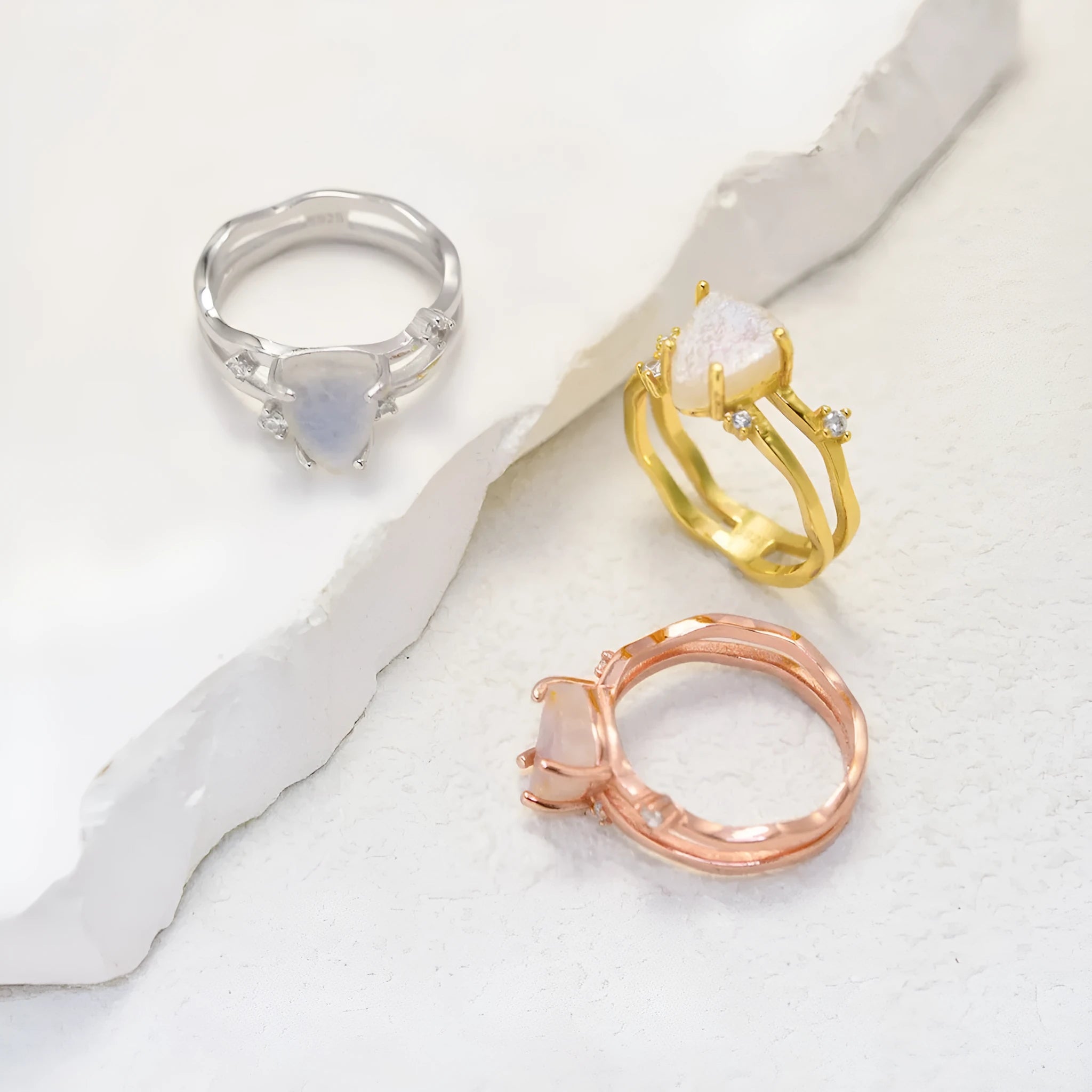 S925 silver ring with irregular triangle shape and moonstone in rose gold, white gold, or yellow gold finish.